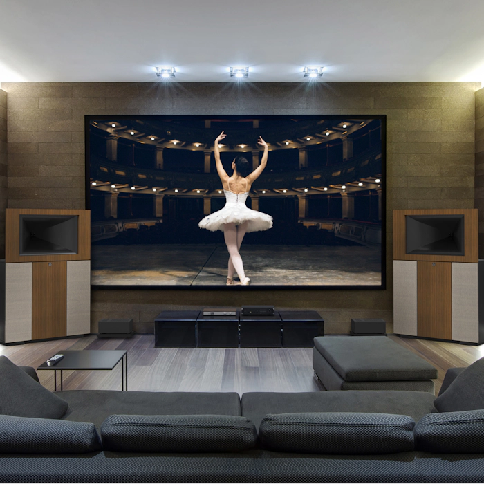 A pair of Klipsch Jubilees flanking a large TV with a ballerina on the screen mobile