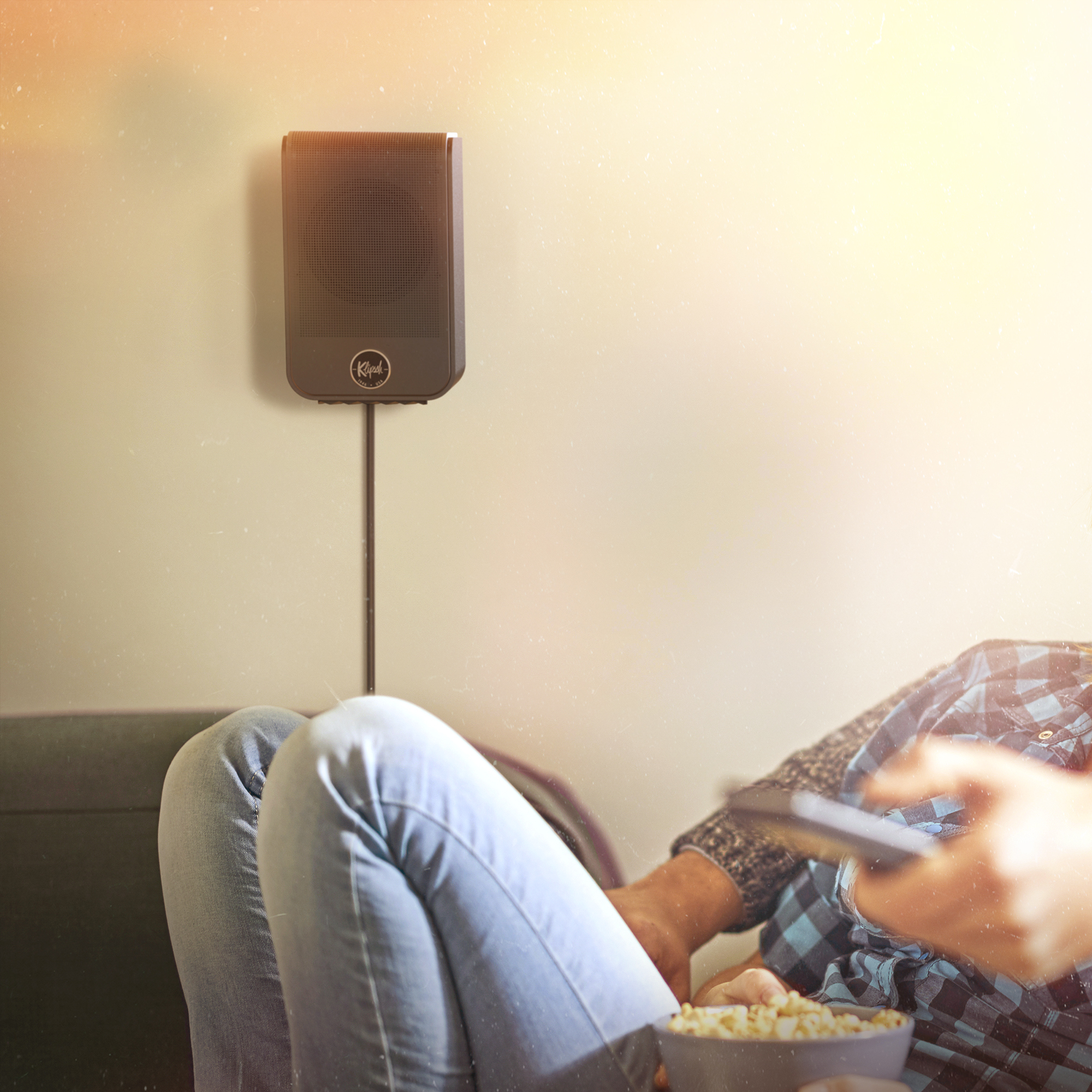 Flexus SURR 100 on Wall Behind Movie Watchers brighter 2000x2000