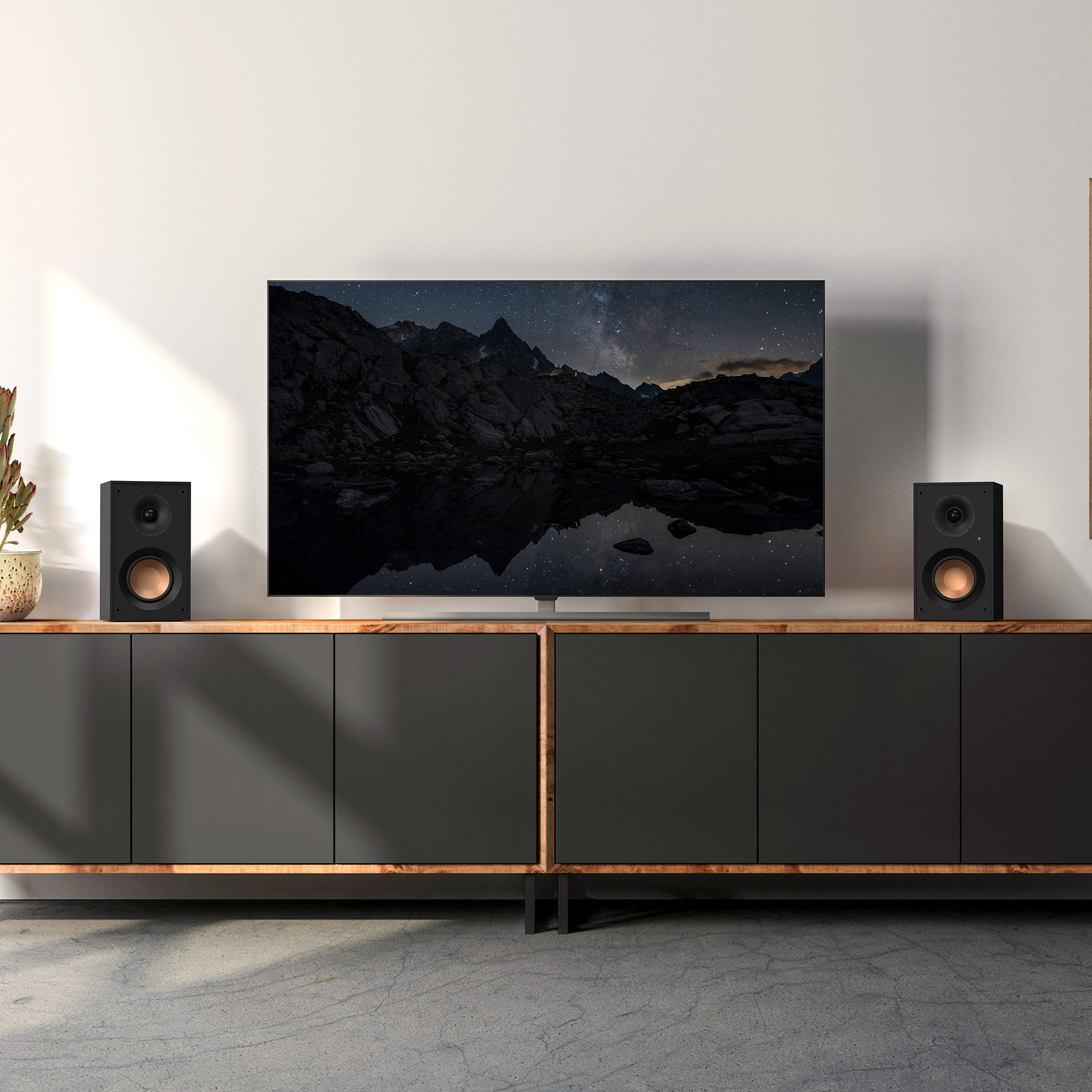 KD 400 on a grey cabinet under a TV that hangs on a wall mobile