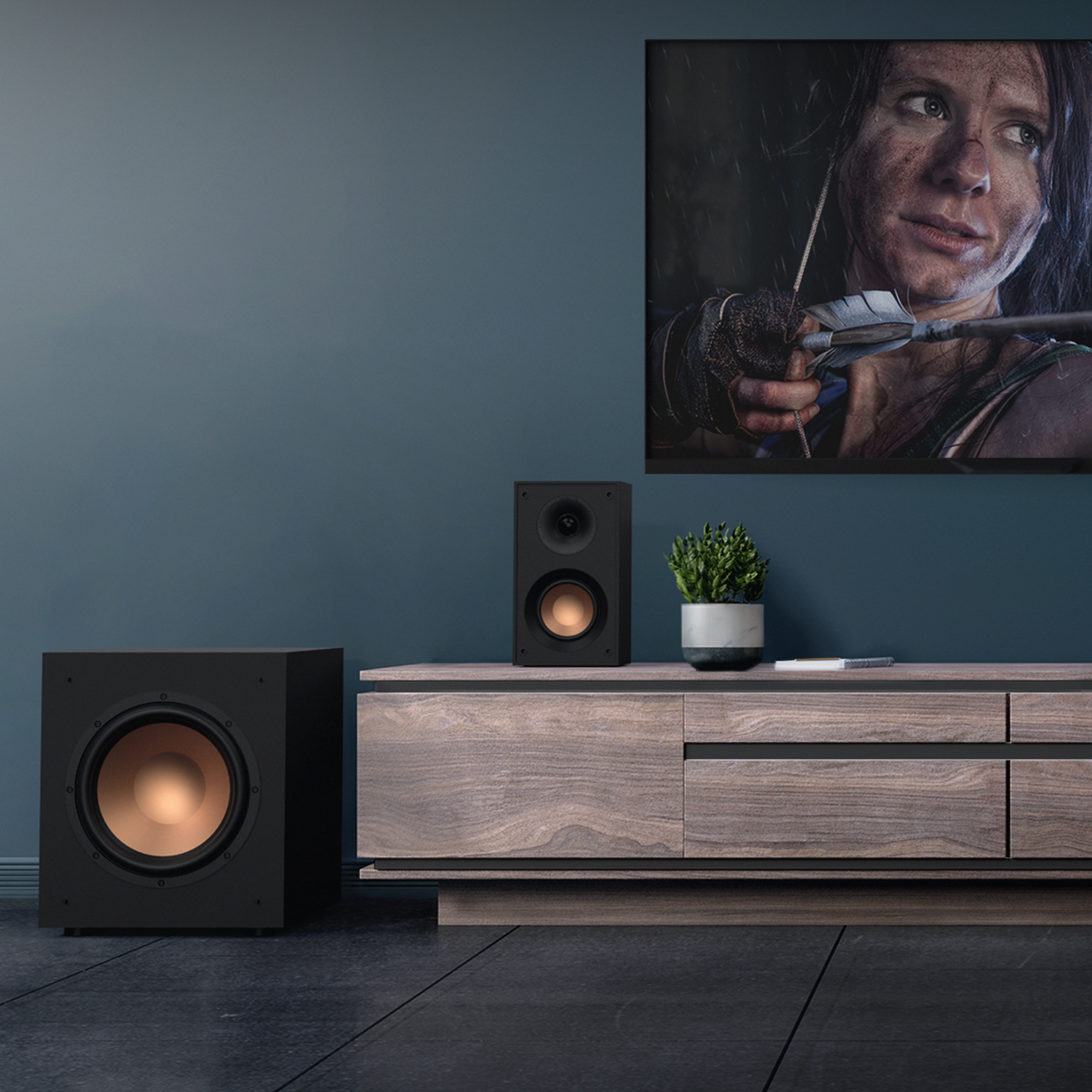 KD 400 on a wooden credenza next to a KD 10 SW subwoofer under a wall mounted TV mobile