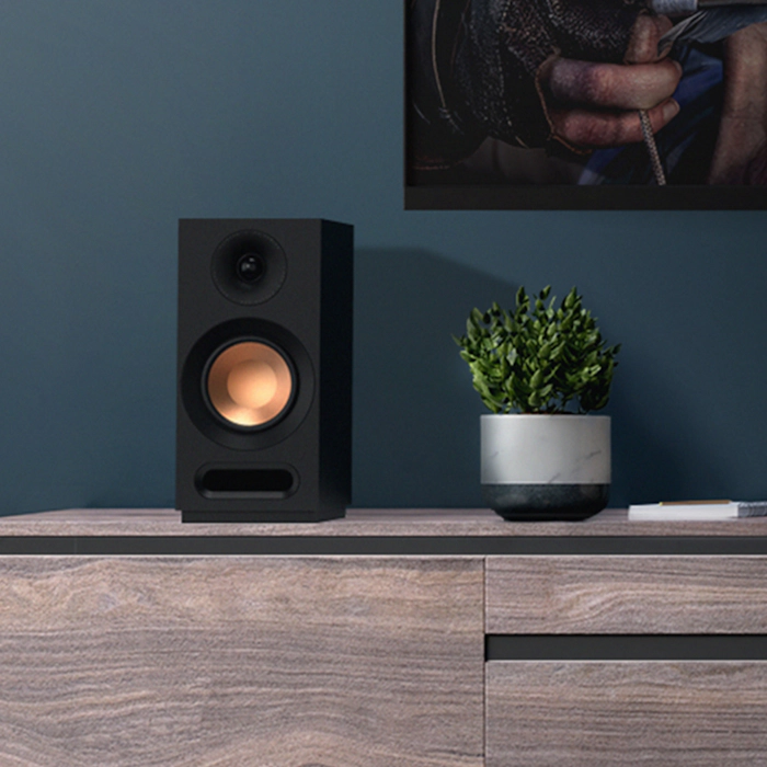 KD 51 M Speaker on a credenza next to a plant mobile