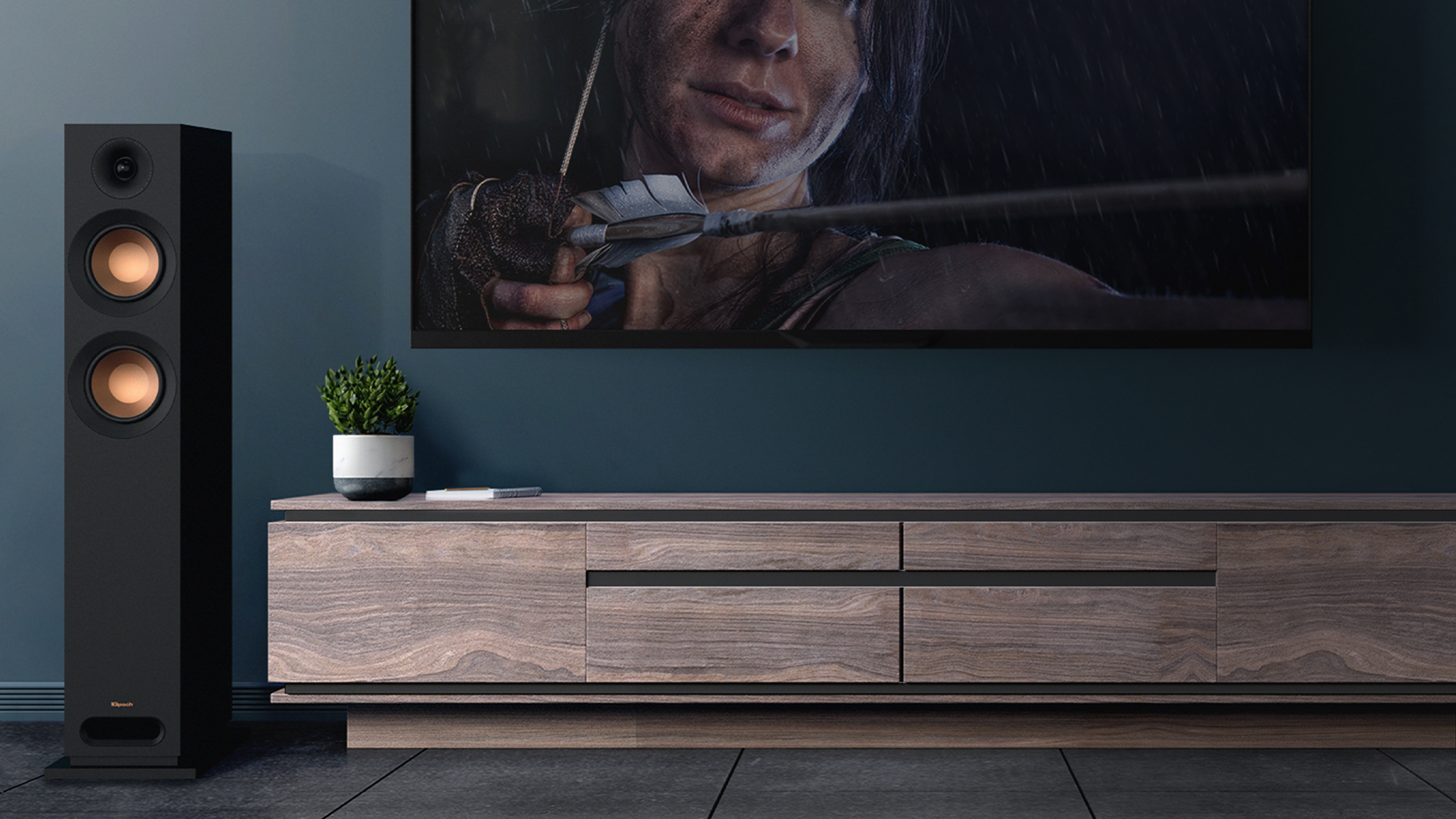 KD 52 F next to a TV and wood credenza with grille off