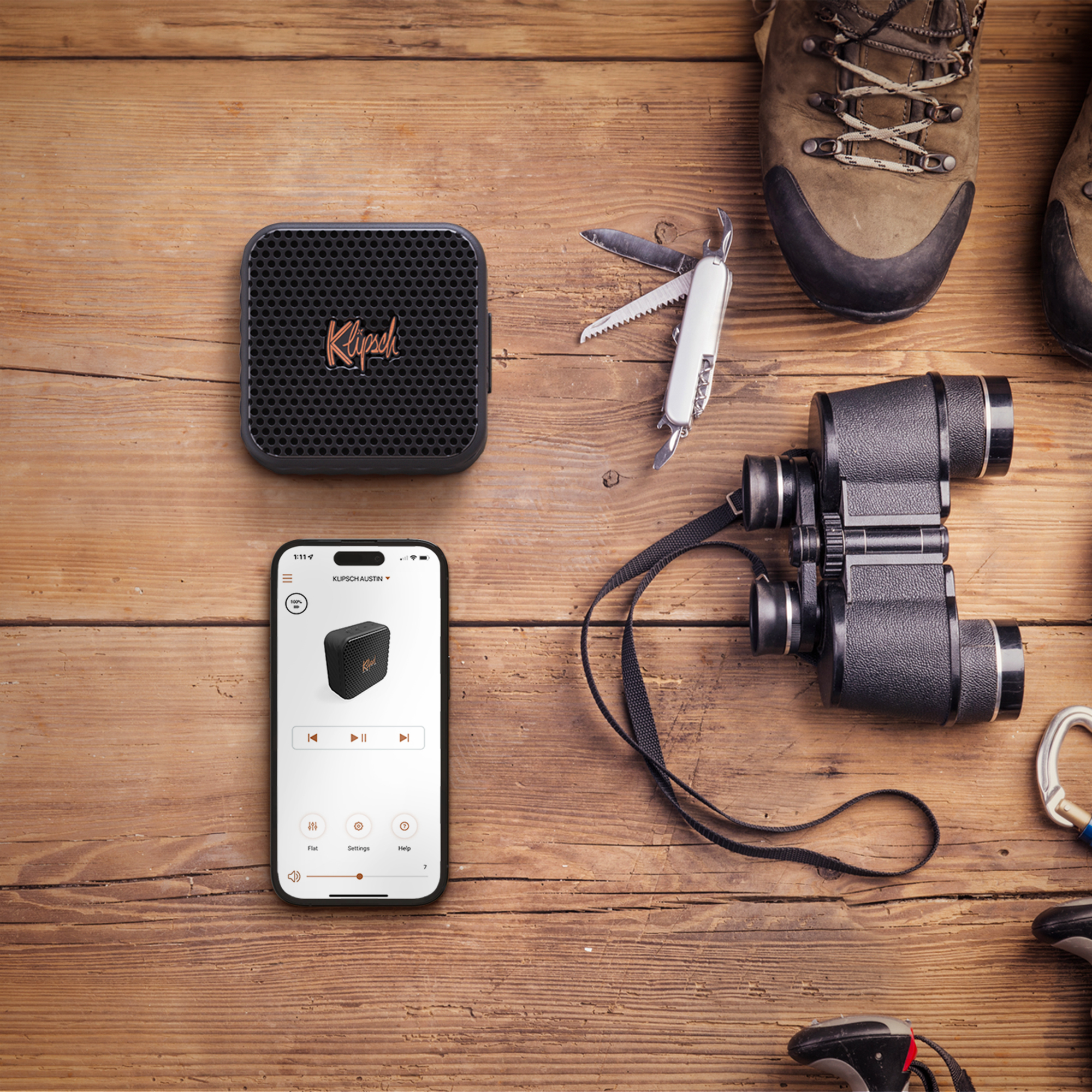 Klipsch Austin flatlay on wooden table with hiking gear 2000x2000