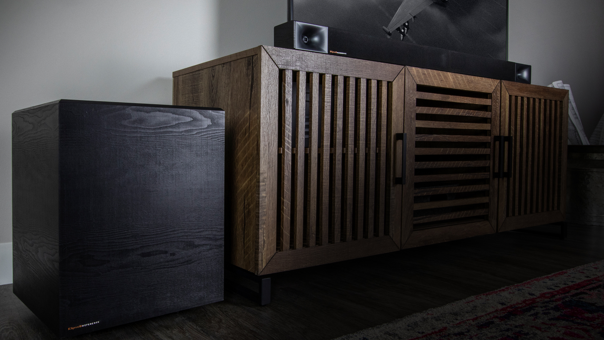 Klipsch Cinema 600 with wireless subwoofer on an entertainment center desktop