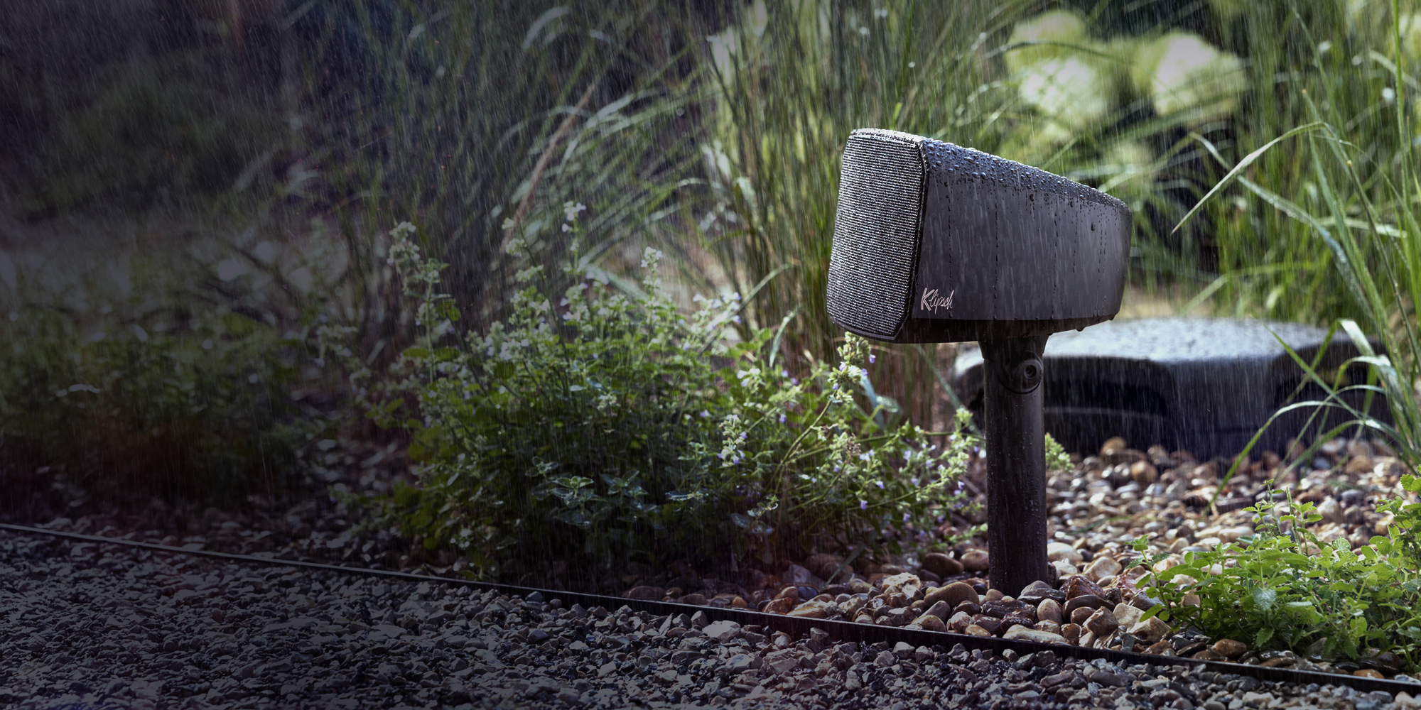 Klipsch Courtyard Satellite speaker and sub in sunshine Animation B whttxt 2000x1000