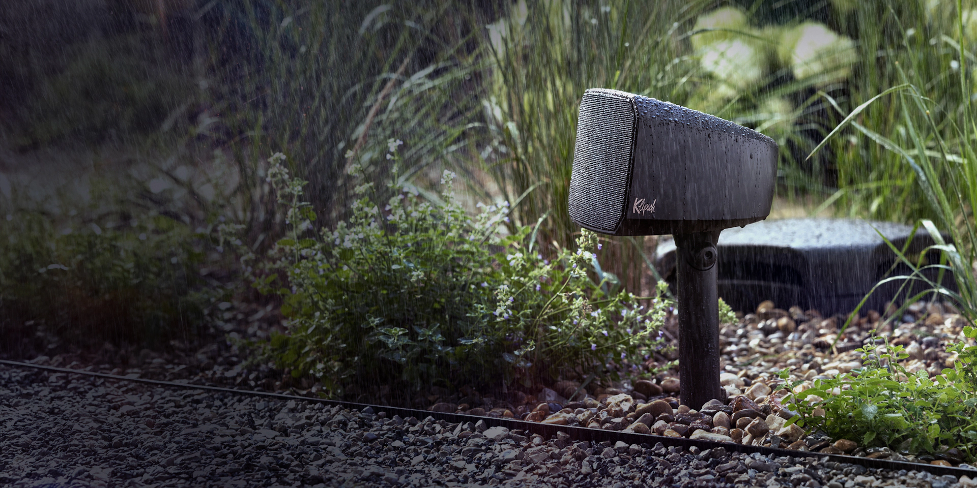 Klipsch Courtyard Satellite speaker and sub in sunshine Animation B whttxt 2000x1000