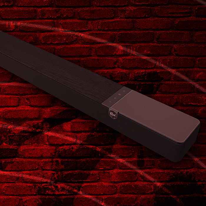 Klipsch Daredevil Partnership Flexus Core against dark red brick wall with circles emanating 2000x2000