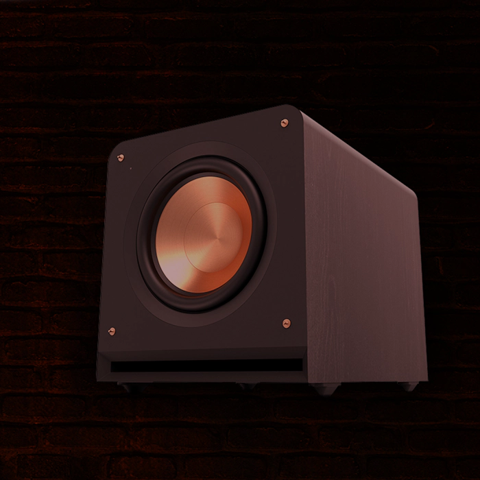 Klipsch Daredevil Partnership Klipsch Reference Premiere Subwoofer against dark red brick wall with circles emanating 2000x2000