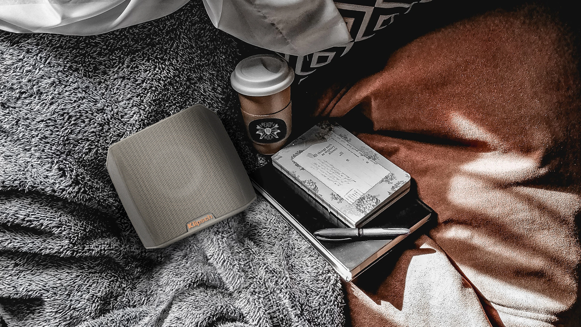 Klipsch Groove portable speaker gray with blanket and coffee