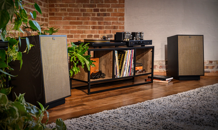 Klipsch Heresy pair in black ash flanking a record player on media console 2000x1200