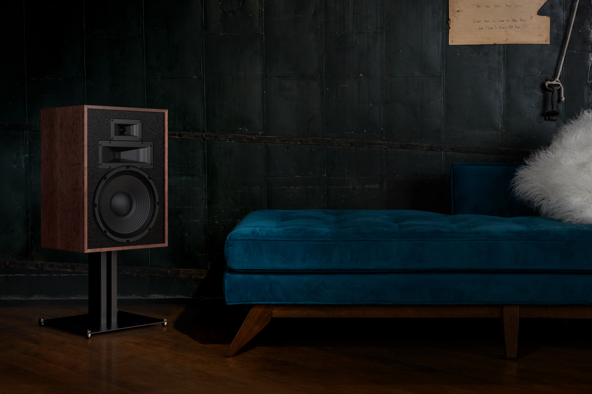 Klipsch KS 12 Loudspeaker Stand is finished in matte black sitting beside teal counch 2000x1333