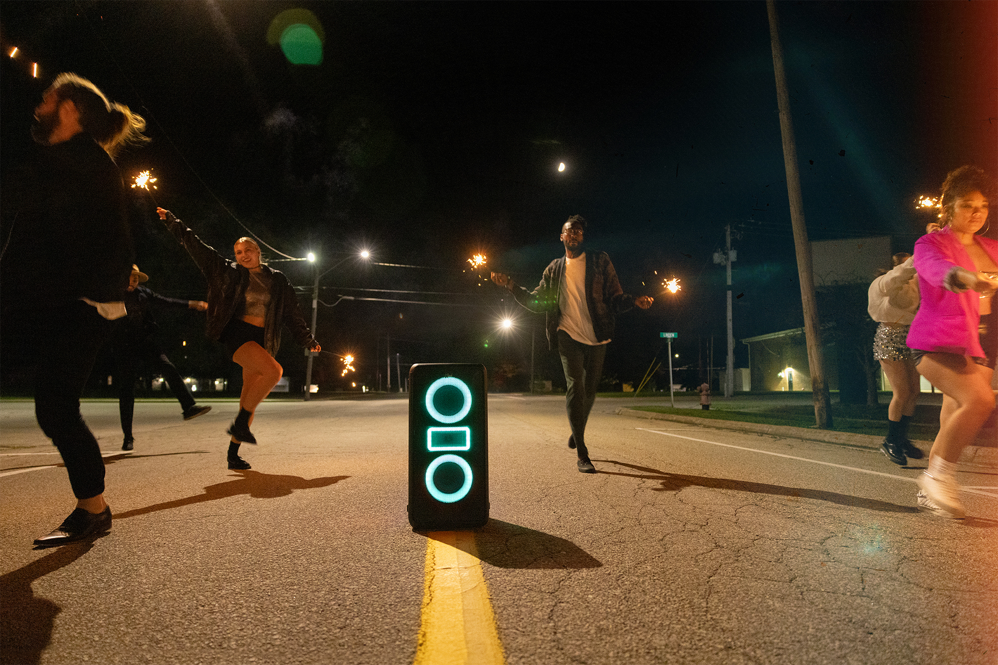 Klipsch Party Speakers Vibe friends running down street with sparklers in hand 2000x1333