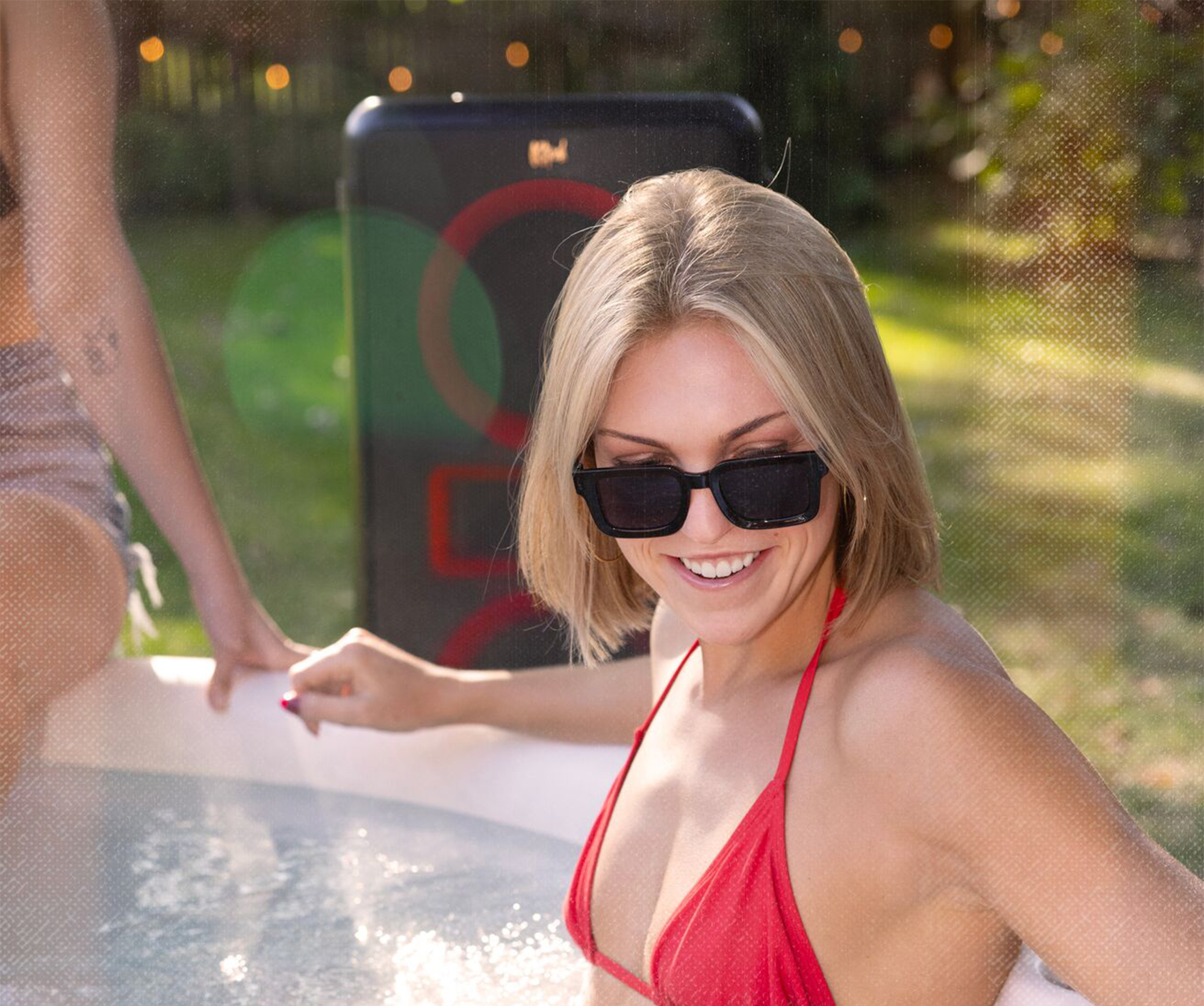 Klipsch Party Speakers Vibe speaker by woman in hot tub 2000x1670