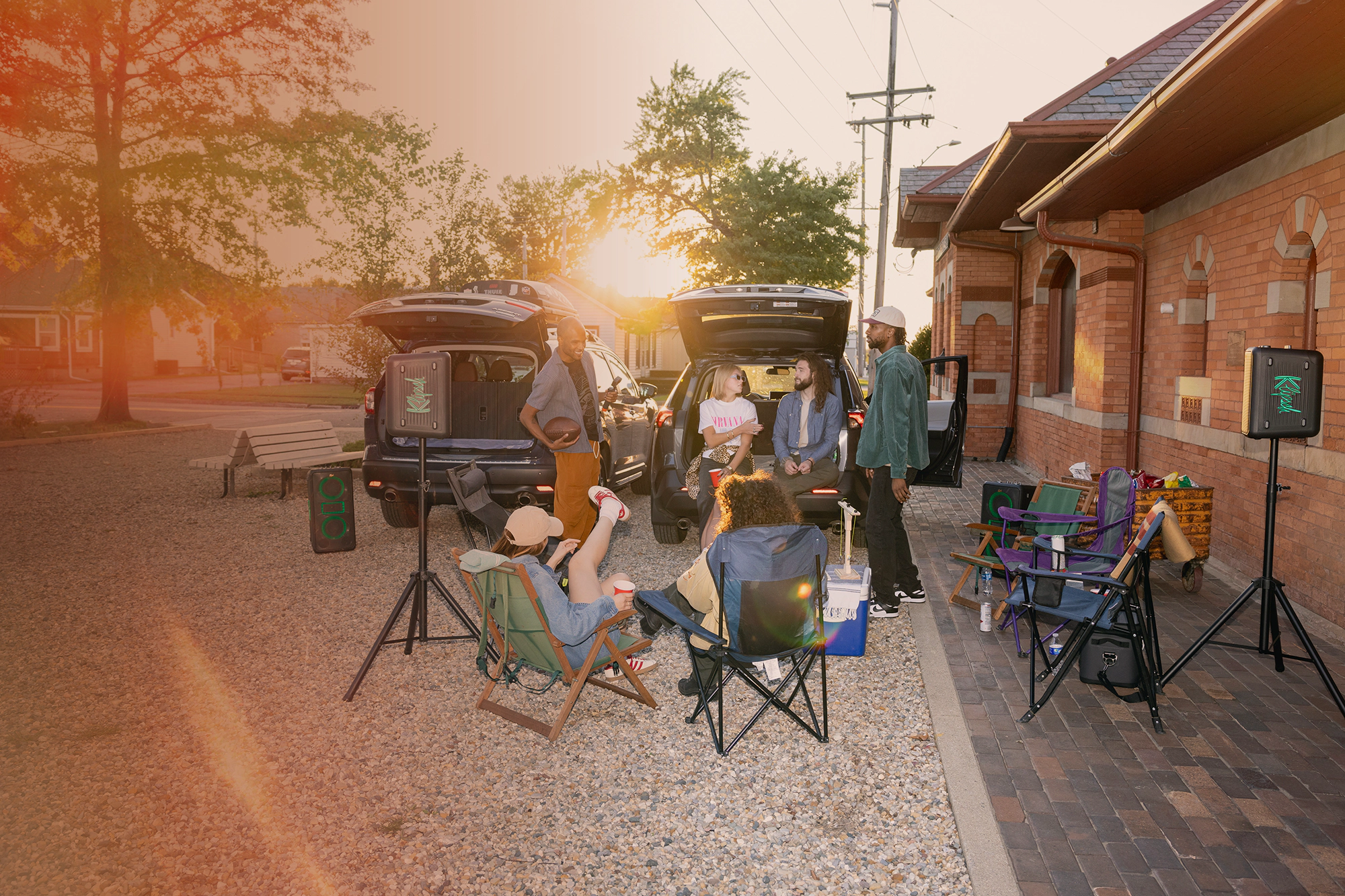 Klipsch Party Speakers Vibe tailgate party with setting sun 2000x1333