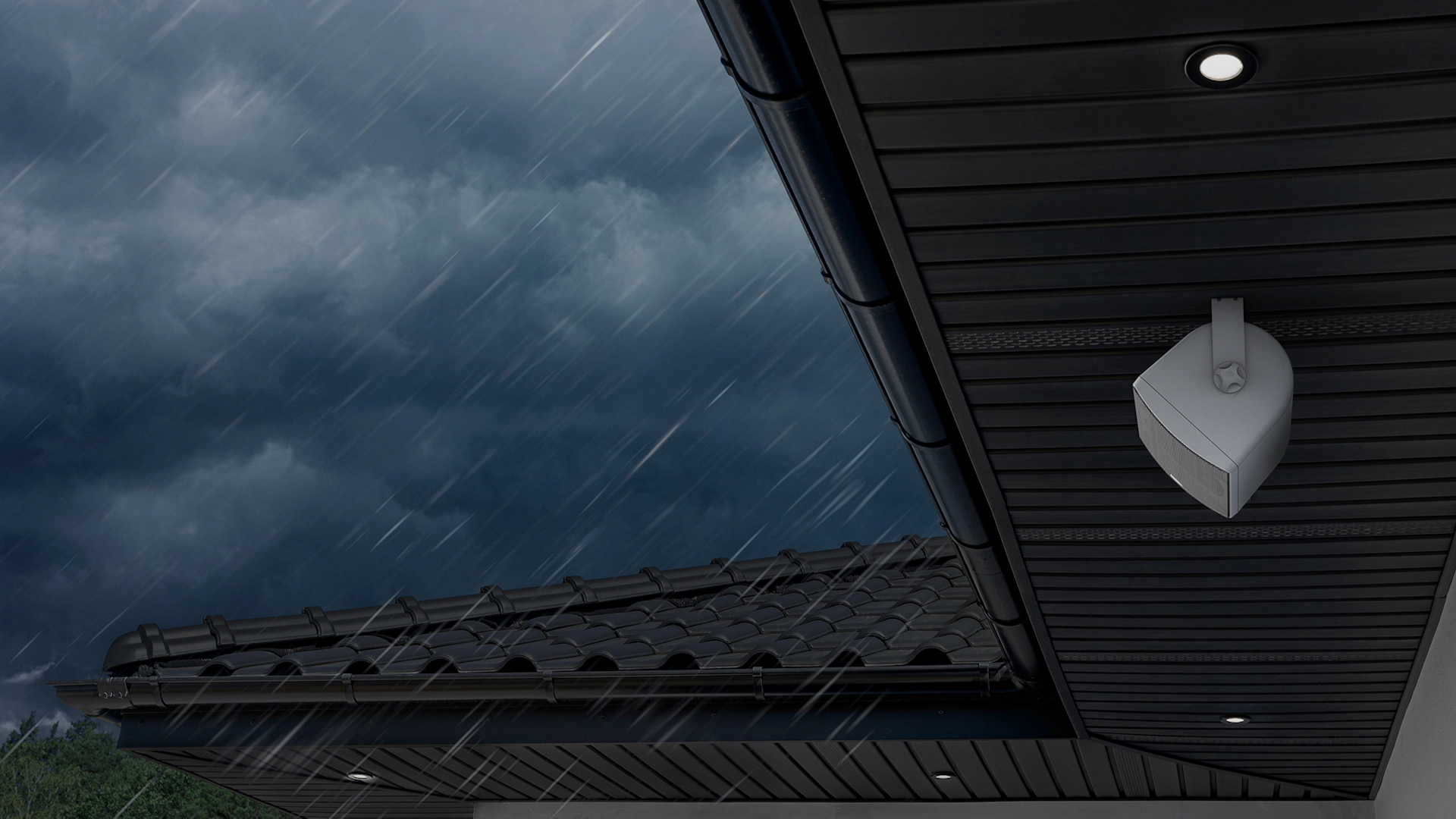 Klipsch RO 525 Outdoor Speaker Under Eaves with Stormy Skies 2000x1333 v01