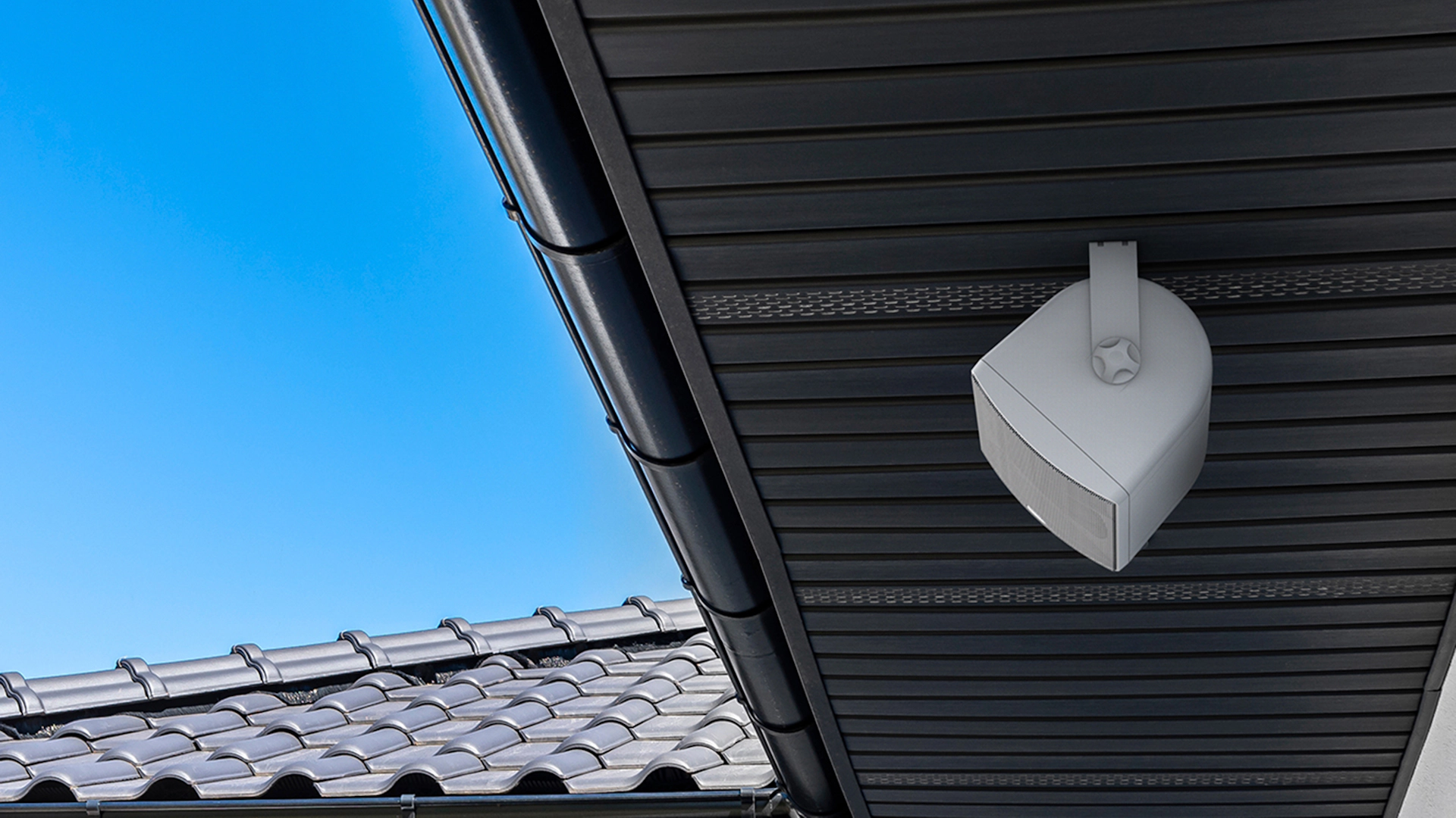 Klipsch RO 525 Outdoor Speaker Under Eaves with Sunny Skies 2000x2000