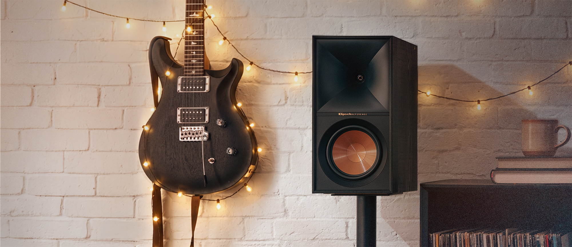 Klipsch Reference Holiday Close Up Beside Guitar 2000x864