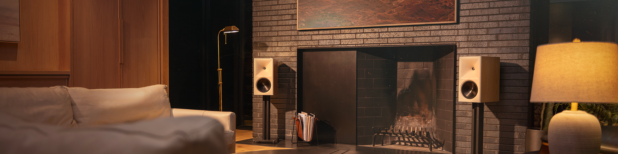 Klipsch The Nines II Red Oak flanking fire place and tv in large living room 2000x500