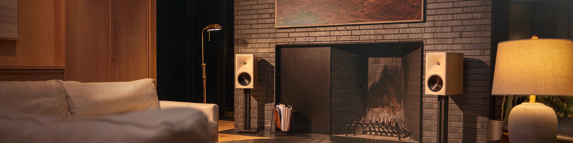 Klipsch The Nines II Red Oak flanking fire place and tv in large living room 2000x500