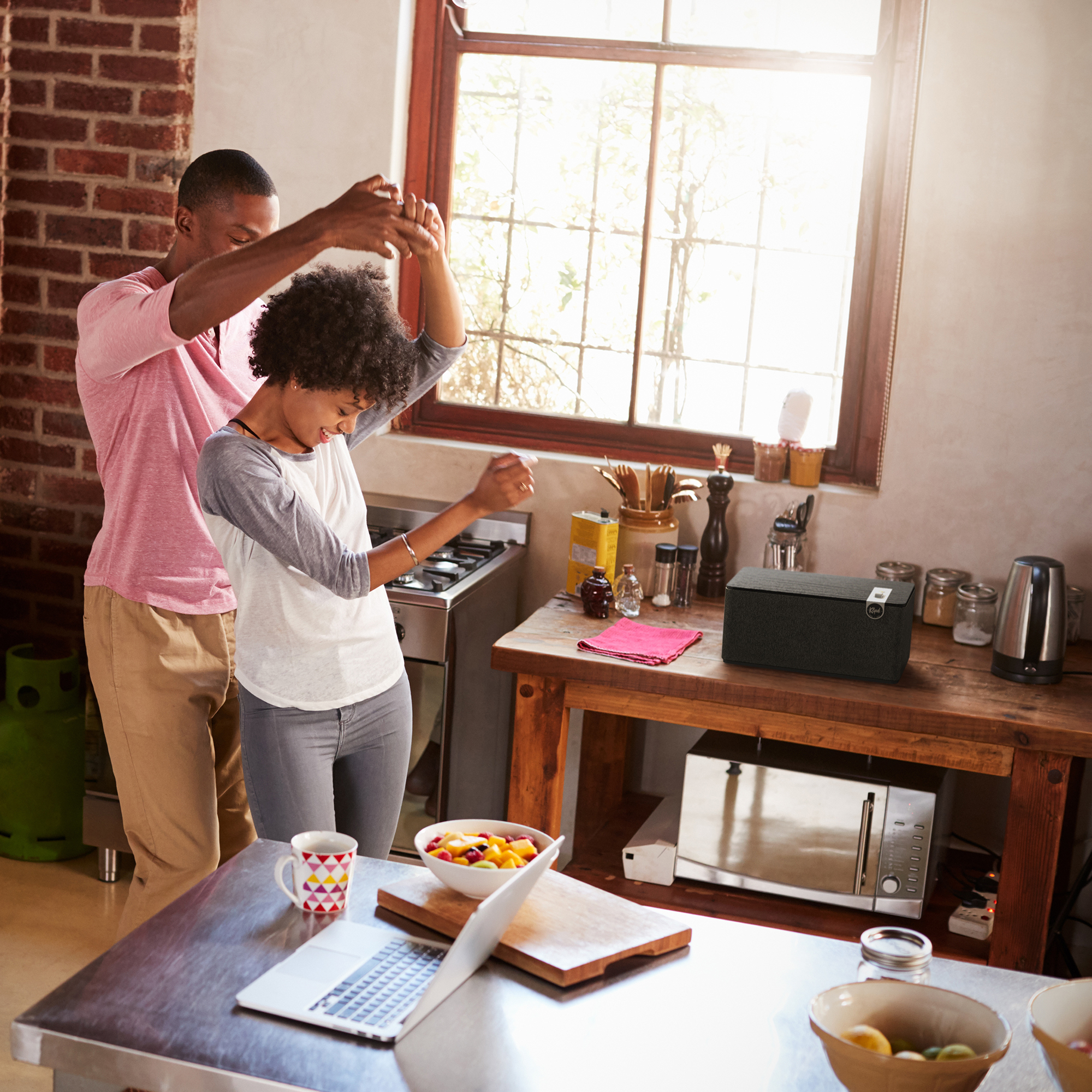 Klipsch The Three Plus with couple dancing in kitchen 2000x2000