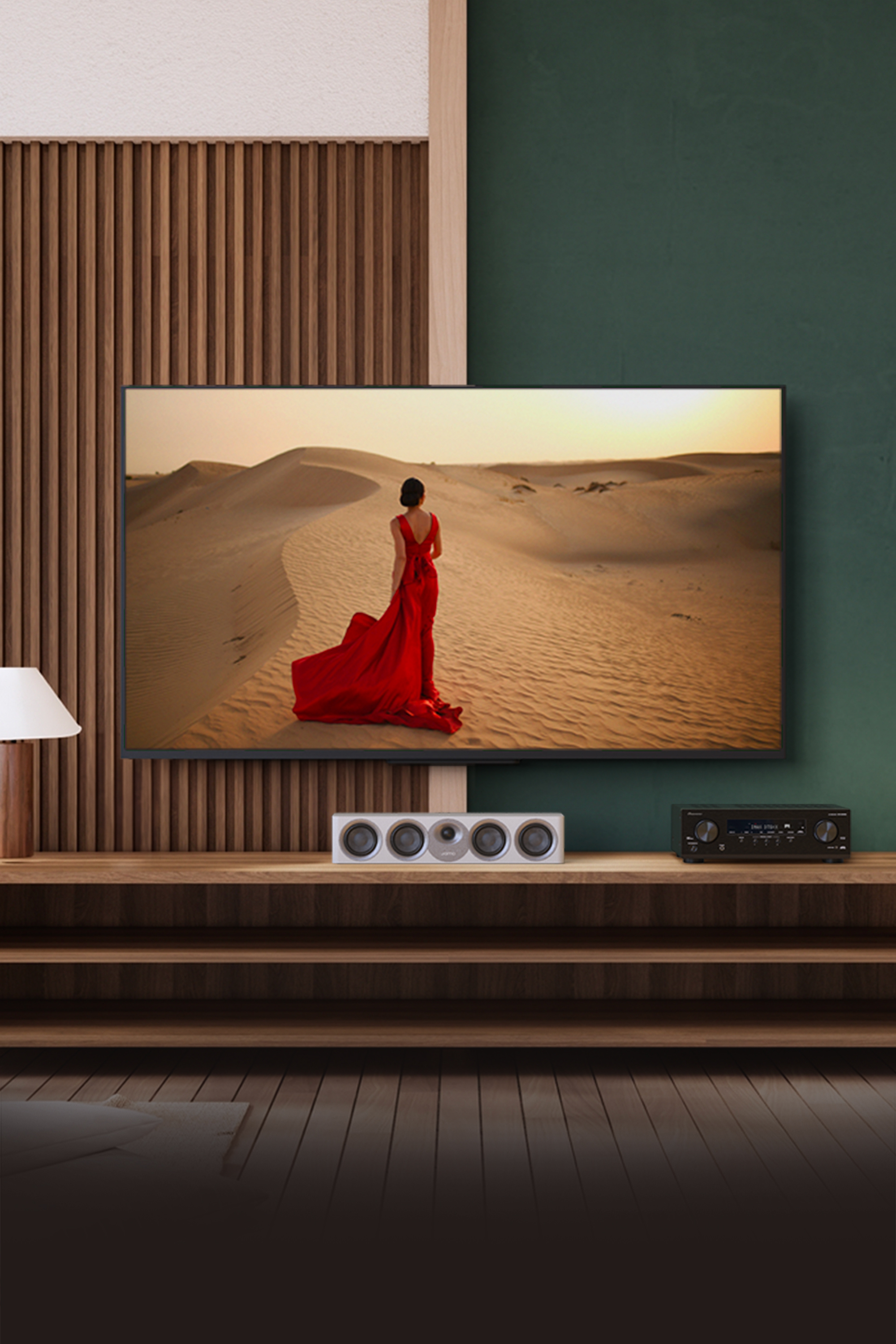 Pioneer VSX 835 powering home Jamo system with red dress woman on tv 2000x3000