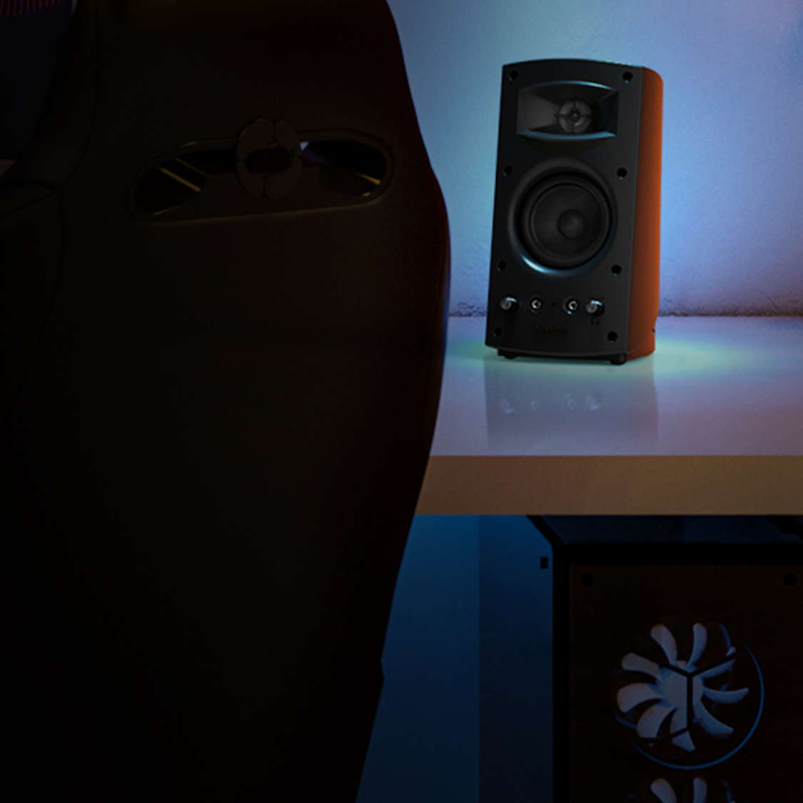 Pro Media 2 0 speaker with grille off on a computer desk mobile