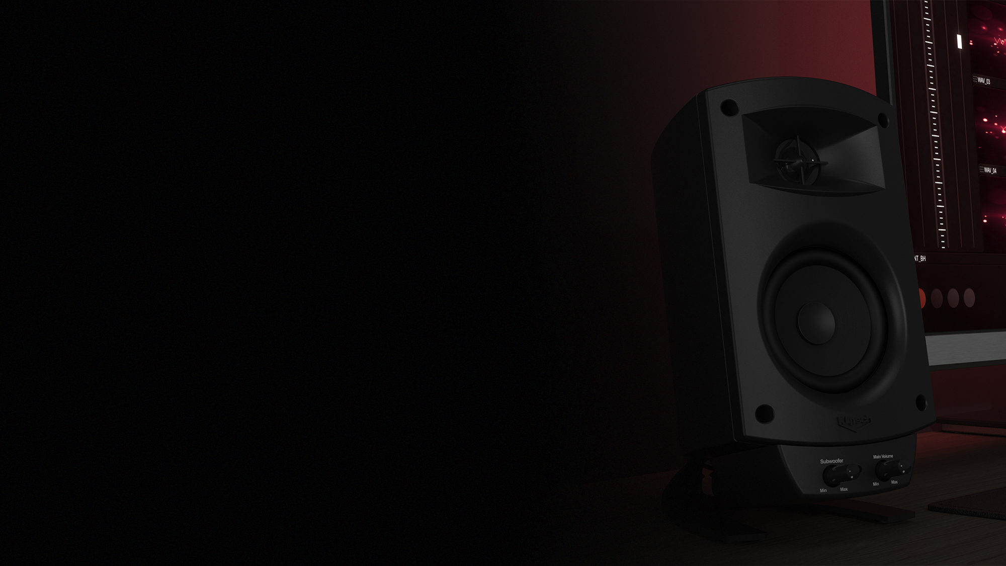 Pro Media 2 1 THX Speaker with controls next to a monitor desktop