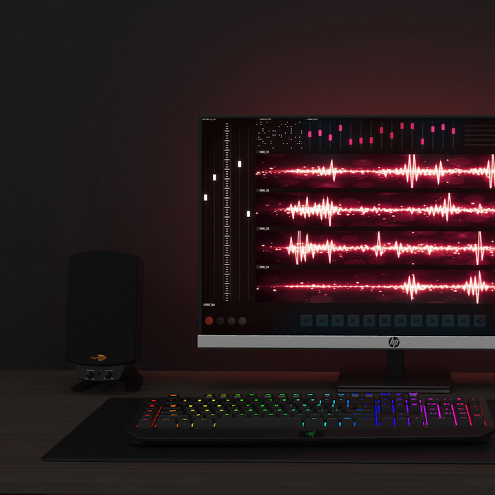 Pro Media 2 1 THX speaker next to computer monitor and keyboard mobile