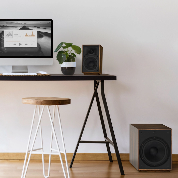 Pro Media Heritage 2 1 Speaker on a computer desk with a subwoofer on the floor mobile