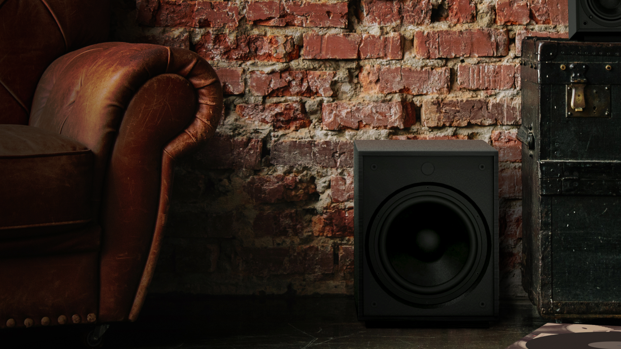 Pro Media Heritage 2 1 Subwoofer between a sofa and a chest and in front of a brick wall
