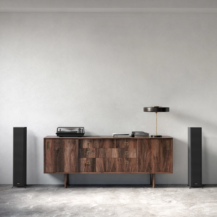 RP 5000 F speakers flanking a nice wooden credenza with a turntable lamp and books on it mobile