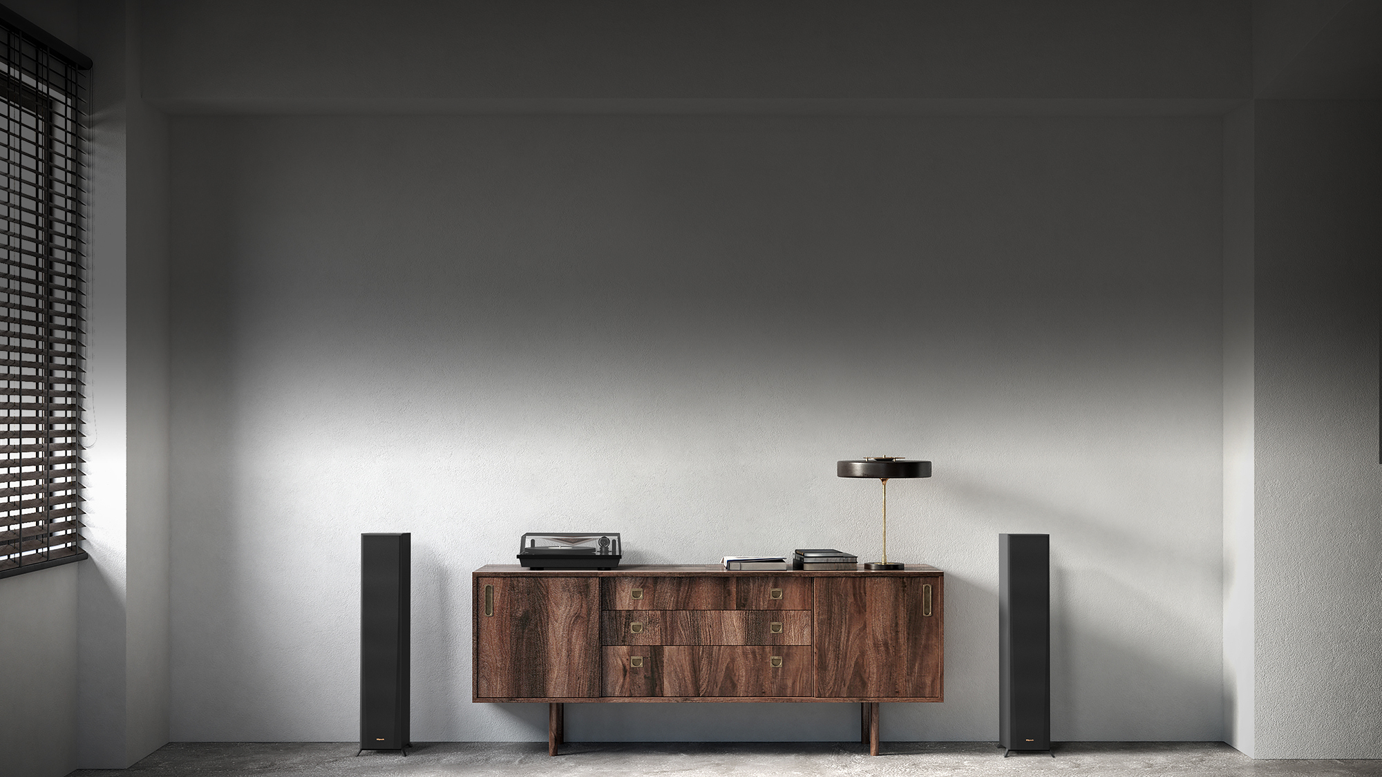 RP 5000 F speakers flanking a nice wooden credenza with a turntable lamp and books on it