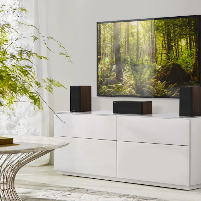 RP 500 C II center channel speaker with RP 500 M II on a grey white credenza Mobile