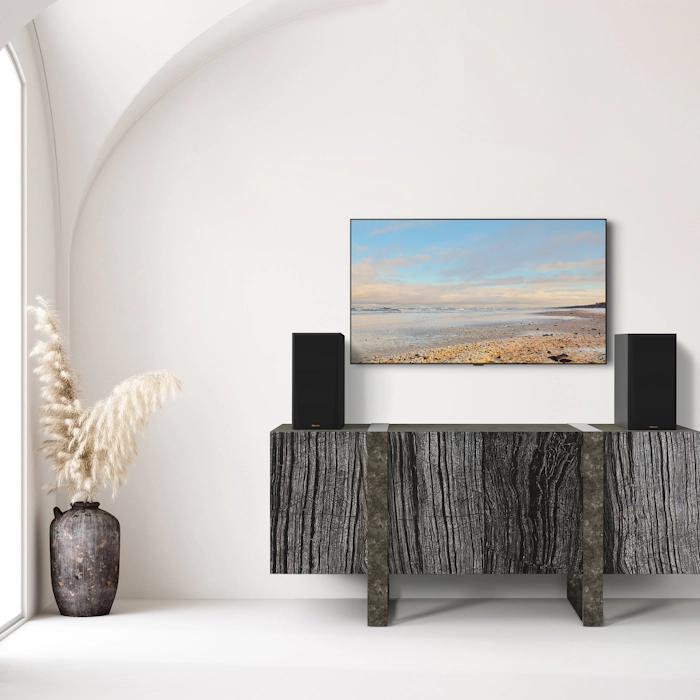 RP 500 M II on a dark grey wooden credenza under a TV mobile