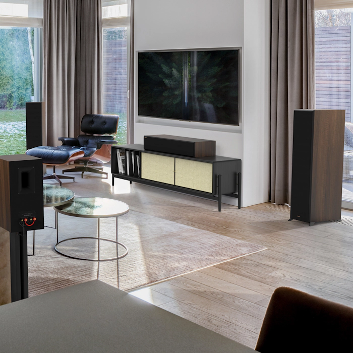 RP 8000 F II speakers in a home theater setting with brown furniture mobile