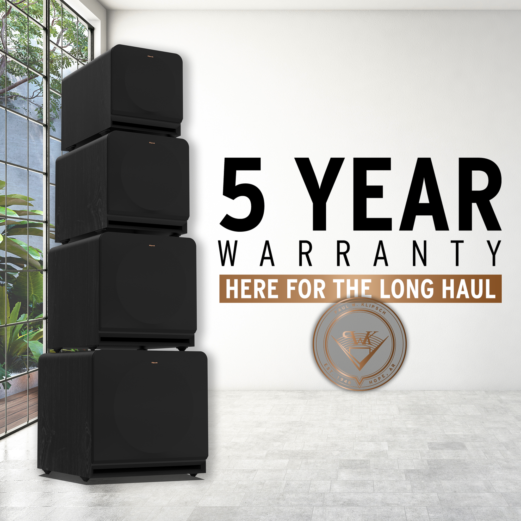 Stack of new Reference Premiere subwoofers with a 5 Year Warranty logo