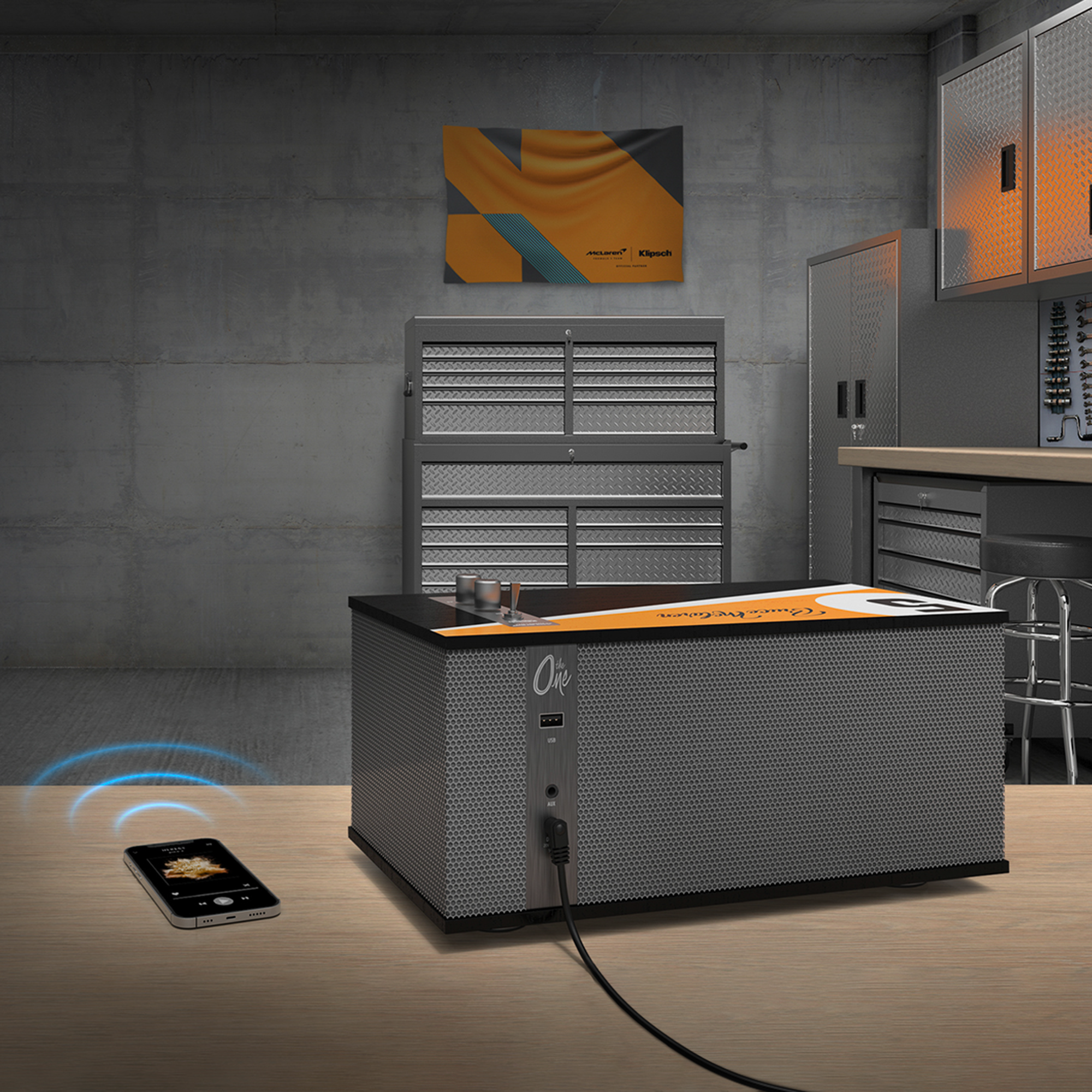 The One II Mc Laren Edition On Table Beside Phone Bluetooth 2000x2000