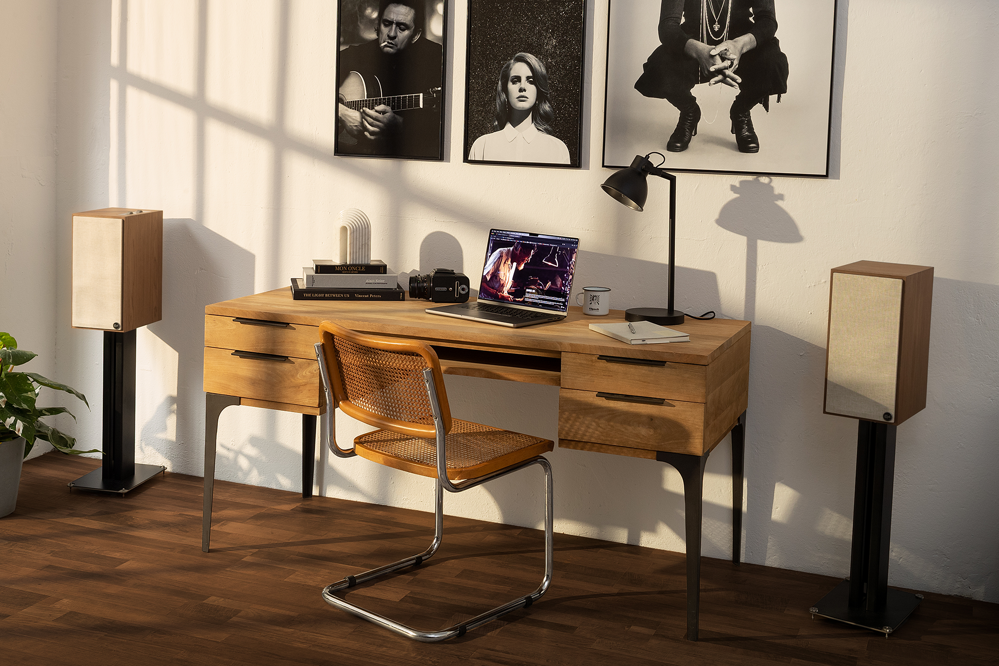 The Sevens walnut on stands beside a desk 2000x1333