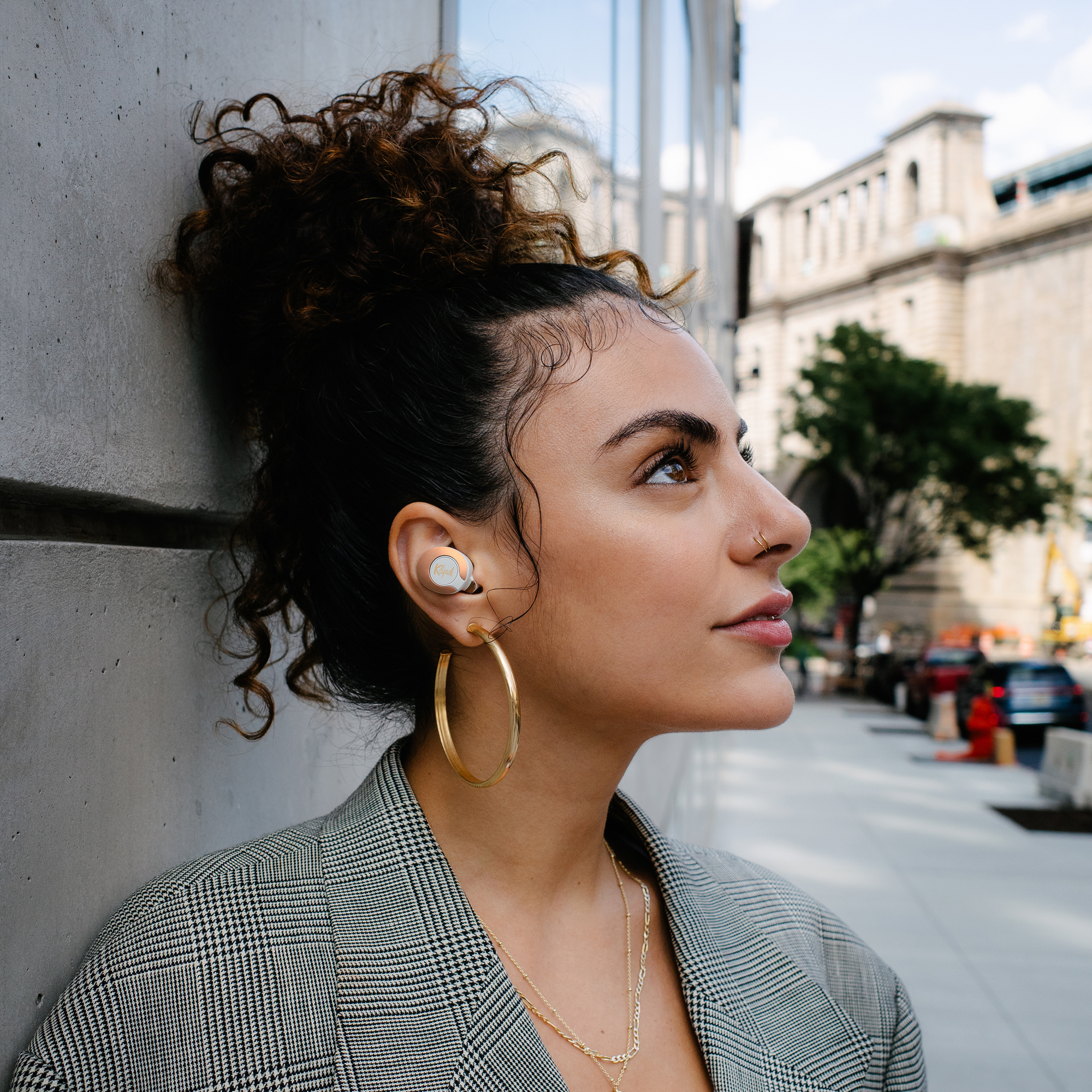 Woman looking upward while wearing Klipsch T5 II True Wireless ANC Earphones Mobile