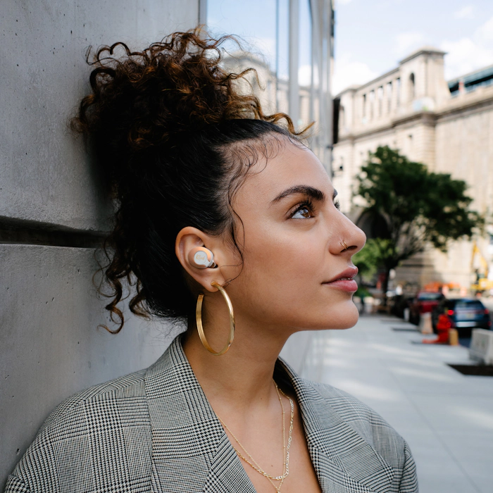 Woman looking upward while wearing Klipsch T5 II True Wireless ANC Earphones Mobile