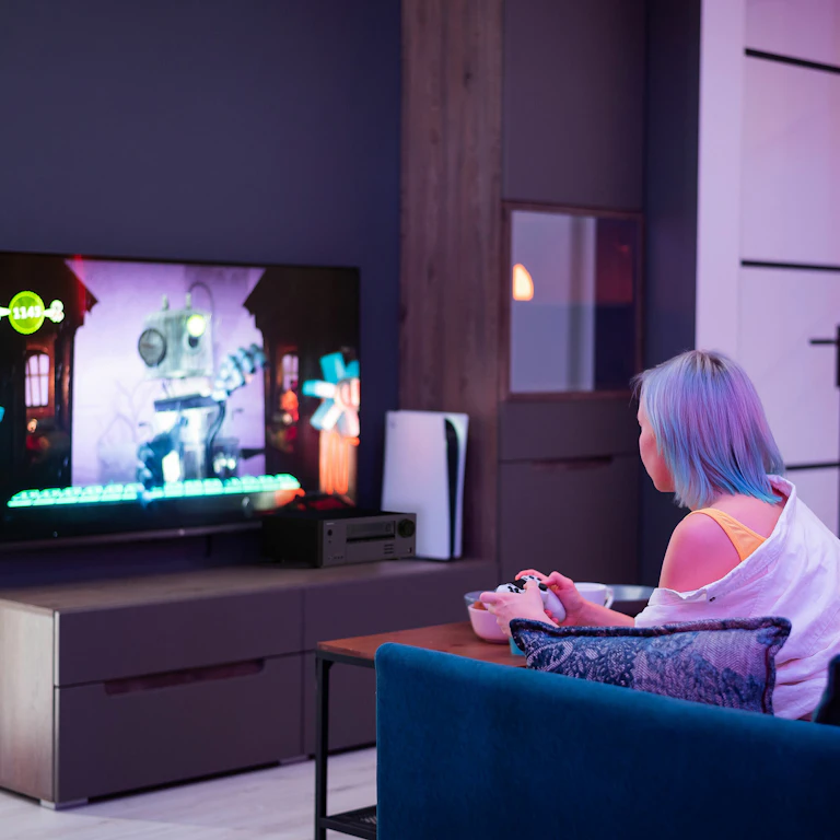 Young Adults Playing Video Games Onkyo TX NR5100 Beside TV MOBILE