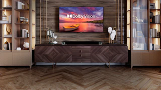 Klipsch Cinema 1200 Sound Bar under a TV with a Dolby Vision logo on it desktop