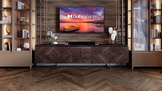 Klipsch Cinema 800 Sound Bar under a TV with a Dolby Vision logo on its desktop
