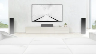 RP 8060 FA II speakers flanking a center channel speaker and TV against a white wall