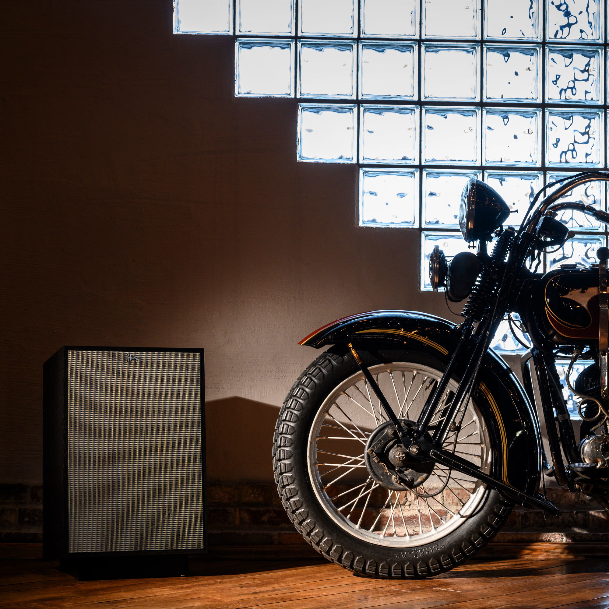 Heresy IV next to a motorcycle