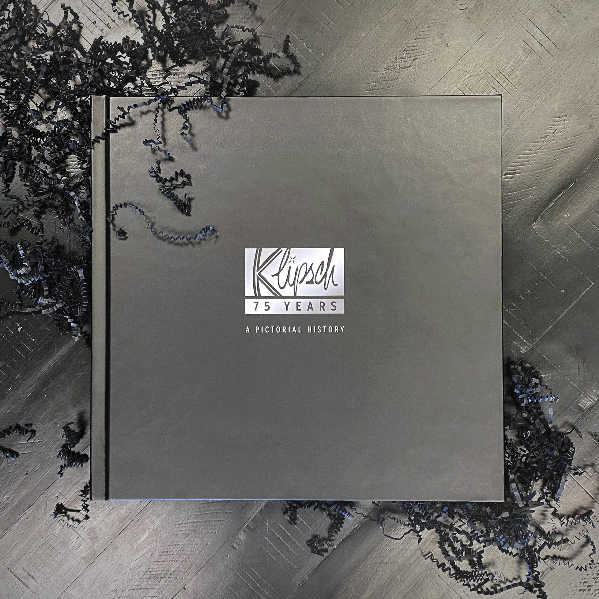 Klipsch 75th anniversary book with black confetti