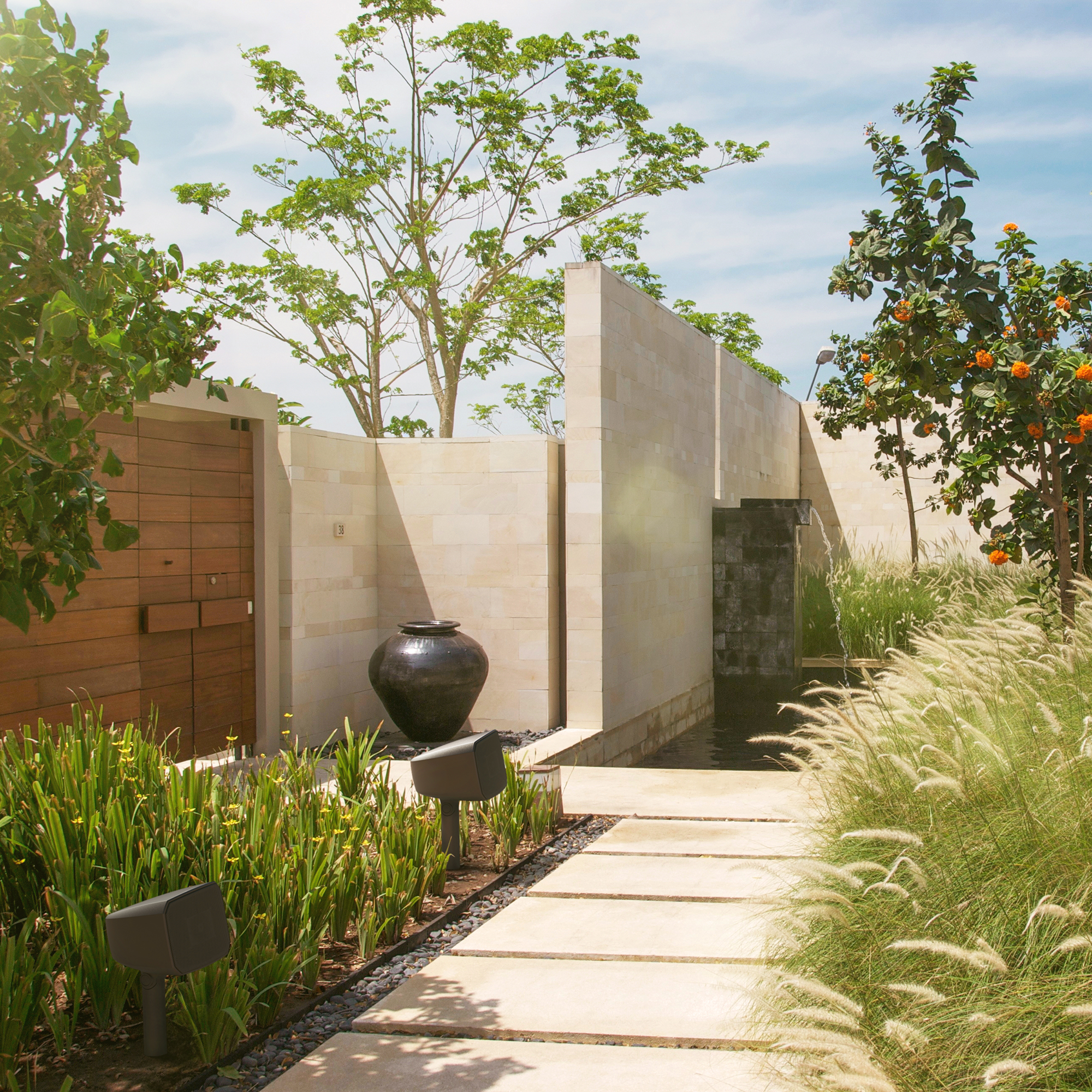 Klipsch Courtyard System in sunny outdoor space 2000x2000