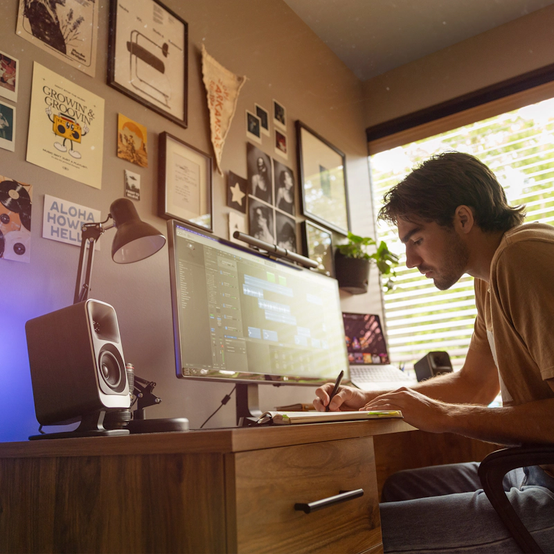 Klipsch Promedia Lumina on Desktop with Man Working 2000x2000