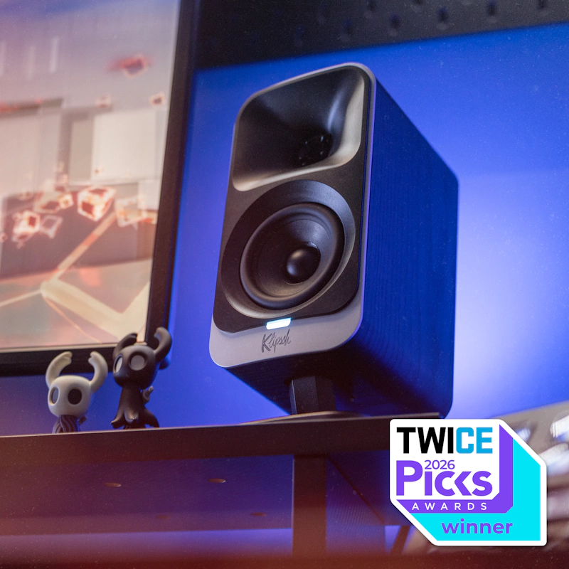 Klipsch Promedia Lumina on desktop wth indigo LED lighting and figurines with TWICE Picks 2026 badge
