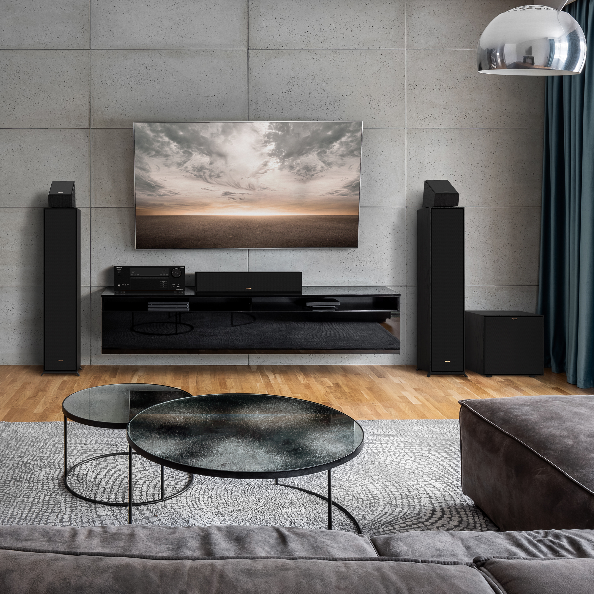 Klipsch R 101 SW Subwoofer in a home theater setting with grilles on 7